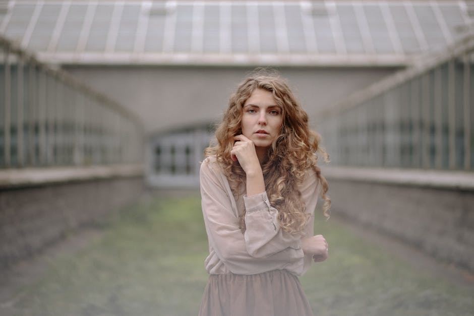Person with closed eyes in a meditative pose feeling serene